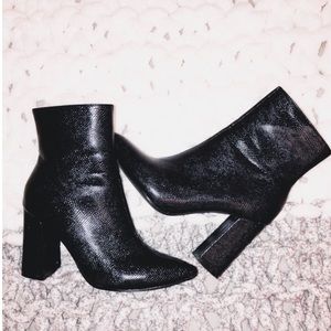 Snake skin high ankle heeled boot.